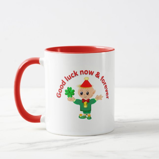 Cute green elf holding a shamrock mug (Left)