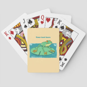 Cute green frog on a lily pad playing cards