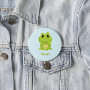 Cute green frog on blue 7.5 cm round badge