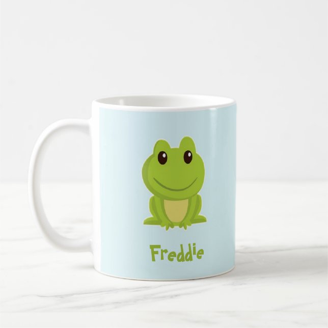 Cute green frog on blue  coffee mug (Left)
