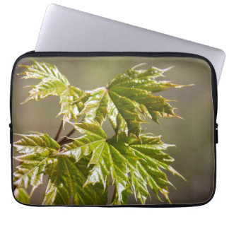 Cute green maple branch with small leaves laptop sleeve
