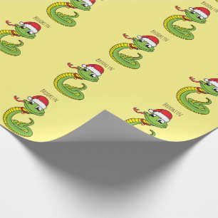 Cute green snake with santa hat cartoon wrapping paper