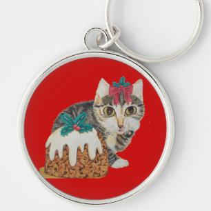 cute grey kitten licking paw at christmas key ring