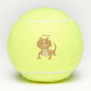 Cute happy bearded dragon lizard cartoon tennis balls