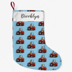 Cute happy cow driving a red tractor cartoon small christmas stocking