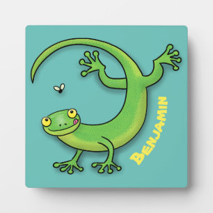 Cute happy green gecko greetings with bug cartoon plaque