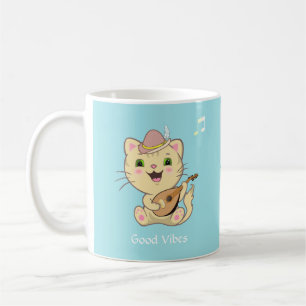 Cute Happy Musical Ginger Tabby Cat on Light Blue Coffee Mug
