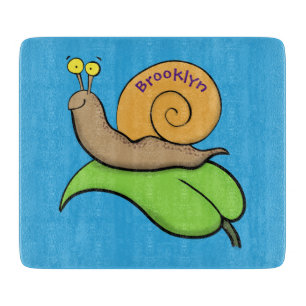 Cute, happy snail on a leaf cartoon illustration cutting board