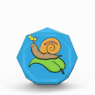 Cute, happy snail on a leaf cartoon illustration photo block
