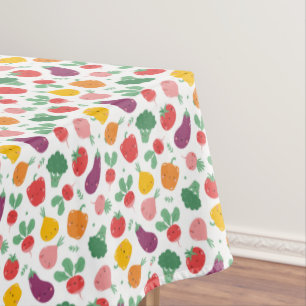Cute happy veggies on white tablecloth