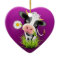 Cute Holstein cow in grass over purple