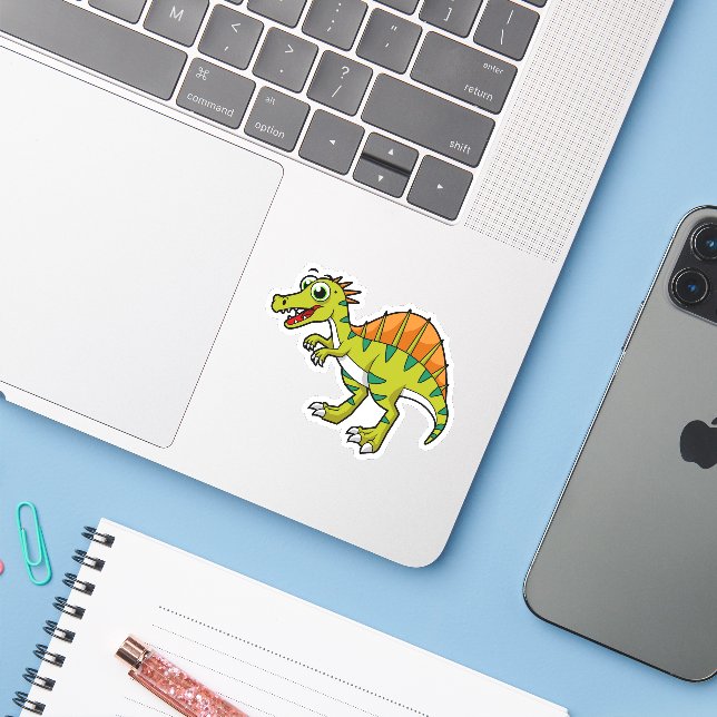 Cute Illustration Of A Smiling Spinosaurus. (Laptop w/ iPhone)