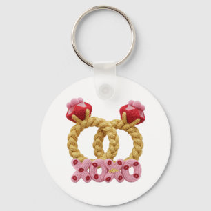 Cute intertwined knitted wedding rings with pink  key ring