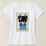 Cute Japanese Kokeshi Doll Dressed In Blue T-Shirt<br><div class="desc">A cute drawing of a Japanese kokeshi doll dressed in a blue kimono with a floral design. She also has black shiny hair with blue ornaments decorating her hair. The background is parchment coloured with a fancy ornate pattern.</div>