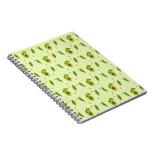 Cute kawaii avocado on green notebook