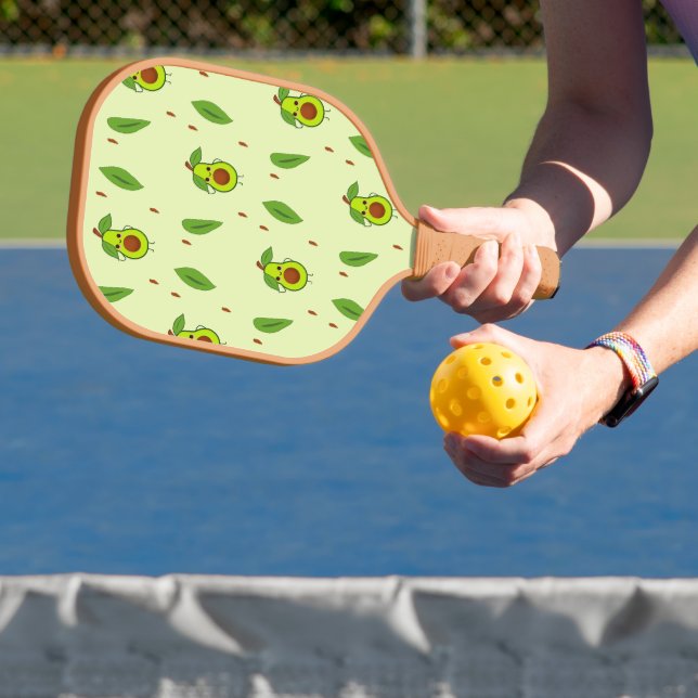 Cute kawaii avocado on green pickleball paddle (Insitu)