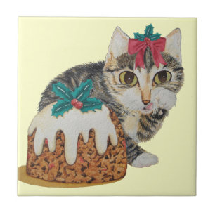 cute kitten grey tabby licking paw christmas tile