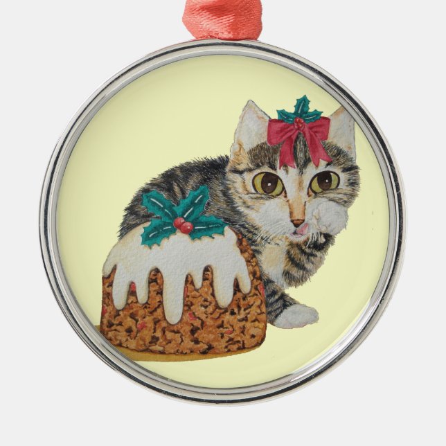 cute kitten tabby cat eating pudding at christmas metal tree decoration (Front)