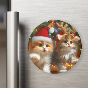 Cute kittens with Santa Claus and reindeer hats Magnet