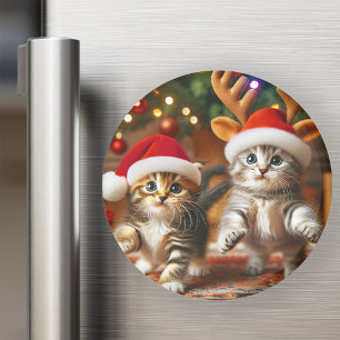 Cute kittens with Santa Claus and reindeer hats Magnet