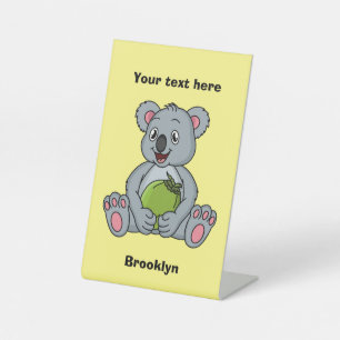 Cute koala and coconut cartoon illustration pedestal sign