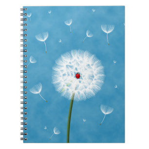 Cute ladybug sitting on top of a dandelion notebook