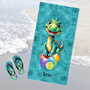 Cute little dinosaur with lots of colourful balloo beach towel