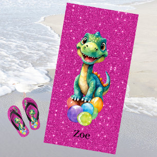 Cute little dinosaur with lots of colourful balloo beach towel