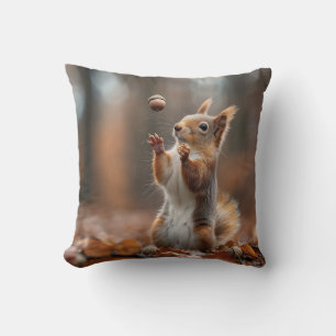 Cute little squirrel catching an acorn cushion