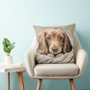 CUTE LONG HAIRED DACHSHUND PUPPY UNDER BLANKET CUSHION