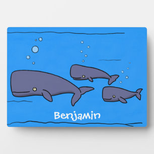 Cute migrating cartoon whales illustration plaque