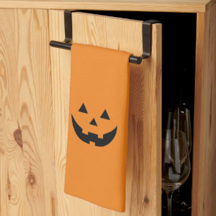 Cute orange jack o lantern pumpkin face Halloween Tea Towel