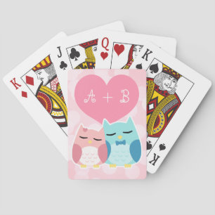 Cute owl couple playing cards