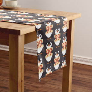 Cute penguin holding sign with the number 99 on it medium table runner