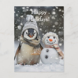 Cute penguin with a snowman winter theme postcard