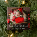 Cute Photo Elegant New Baby First Christmas Ceramic Ornament<br><div class="desc">Cute holiday birth announcement ornament featuring a simple design with "Our First Christmas as a Family of Three" in an elegant script over your favourite newborn photo. The back has a second picture along with baby's name and birth stats. Upload an ultrasound photo and add your baby's name and due...</div>
