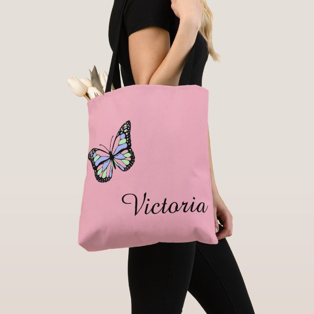 Cute Pink and Black Cursive Script Name Butterfly Tote Bag (Close Up)