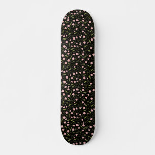 Cute, pink flower on black with repeating pattern skateboard