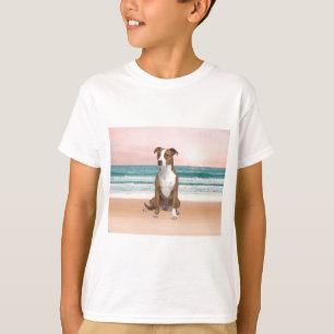 Cute Pitbull Dog Sitting on Beach with sunset T-Shirt
