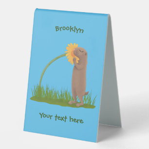 Cute prairie dog sniffing flower cartoon