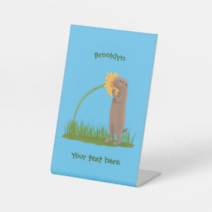 Cute prairie dog sniffing flower cartoon  pedestal sign