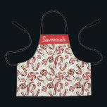 Cute Red & White Candy Cane Candies Pattern  Apron<br><div class="desc">Cute Christmas candy pattern with white and red swirl candies and faux glitter with customisable name.</div>
