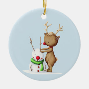 Cute reindeer building a snowman illustrated ceramic tree decoration
