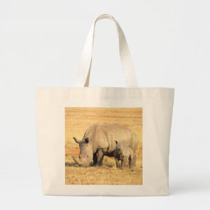 Cute rhinoceros in africa large tote bag