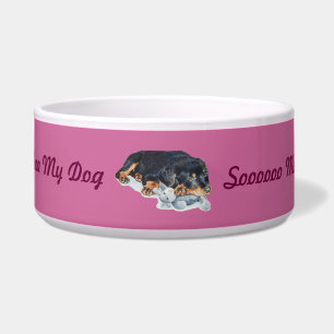 cute rottweiler puppy dog cuddling teddy