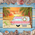 Cute RV Camper Warmest Wishes Beach Christmas Holiday Card<br><div class="desc">This Warmest Wishes holiday Christmas greeting card features a cute RV Camper at the beach. It is decorated with lights, a wreath and two pink Santa flamingo yard decorations. The camper is surrounded by palm trees with festive holiday lights and in the background the sun is setting (or rising) over...</div>