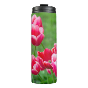 Cute scarlet tulips in the garden thermal tumbler