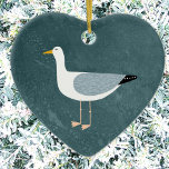 Cute Seagull Ceramic Ornament<br><div class="desc">A cheeky seagull standing by the deep green ocean. Perfect for those who love sassy birds and the coast. Original art by Nic Squirrell.</div>