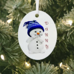 Cute Snowman 1st Christmas Ornament<br><div class="desc">Cute snowman in a blue ski cap, is featured on this metal oval, baby's 1st Christmas ornament. You can make name and year personal on this two sided ornament. Front of ornament has baby's name and back of ornament reads, "Baby's First Christmas and year". A wonderful decoration on your Christmas...</div>