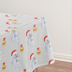 Cute Snowman and Golden Ball on Light Silver Grey Tablecloth